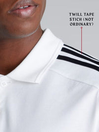 Close-up of a white polo shirt with black stripes and text 'Twill Tape Stitch (Not Ordinary)' on a gray background.